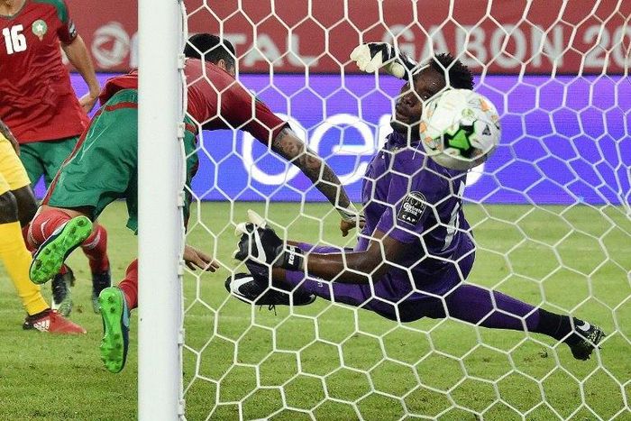 Togo goalkeeper Kossi Agassa (right) concedes a goal during the Africa Cup of Nations match against Morocco in Oyem, Gabon, on January 20, 2017