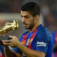 Luis Suarez displays the 2015-2016 Golden Shoe award for the leading goalscorer from the top division of every European national league