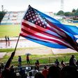 Fans wave Cuban and US flags on June 2, 2015, during the friendly game in Havana between the New York Cosmos and Cuba