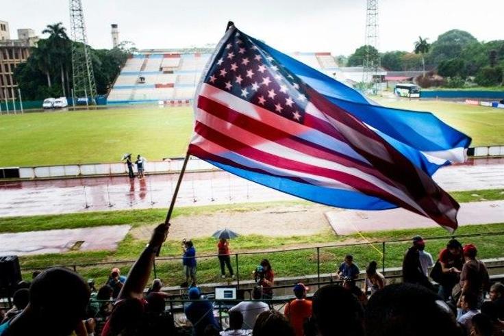 Fans wave Cuban and US flags on June 2, 2015, during the friendly game in Havana between the New York Cosmos and Cuba