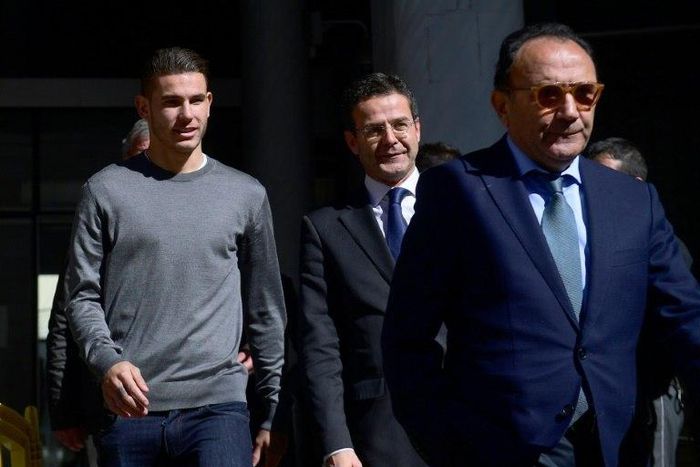 Atletico Madrid's French defender Lucas Hernandez (L) leaves the Madrid's Criminal Court Nr. 35, which specialises in domestic violence, on February 21, 2017