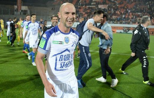 Troyes' midfielder Benjamin Nivet celebrates at the end of the play-off match against Lorient on May 28, 2017