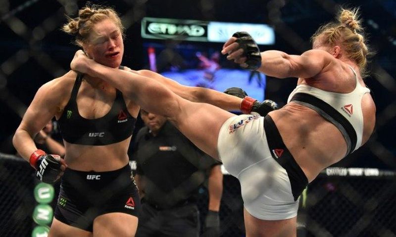 Holly Holm (right) knocked out Ronda Rousey with a kick to the head during their 2015 UFC title fight in Melbourne
