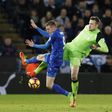 Liverpool's goalkeeper Simon Mignolet (R) clashes with Leicester City's striker Jamie Vardy at King Power Stadium in Leicester, central England on February 27, 2017