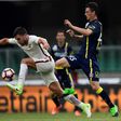 AS Roma's Kevin Strootman vies with Chievo's Roberto Inglese during the Italian Serie A football match on May 20, 2017