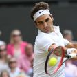 Switzerland's Roger Federer plays against Canada's Milos Raonic during the Wimbledon Championships men's semi-final match in southwest London, on July 8, 2016