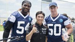 Indianapolis 500 Champion Takuma Sato (C) stands with Jaylon Smith and Sean Lee of the Dallas Cowboys in Frisco, Texas