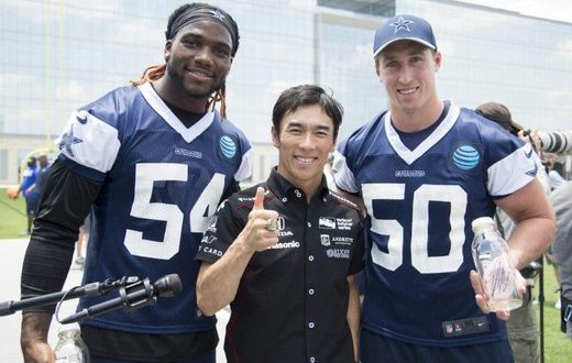 Indianapolis 500 Champion Takuma Sato (C) stands with Jaylon Smith and Sean Lee of the Dallas Cowboys in Frisco, Texas