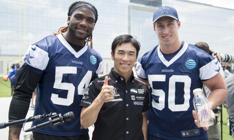 Indianapolis 500 Champion Takuma Sato (C) stands with Jaylon Smith and Sean Lee of the Dallas Cowboys in Frisco, Texas