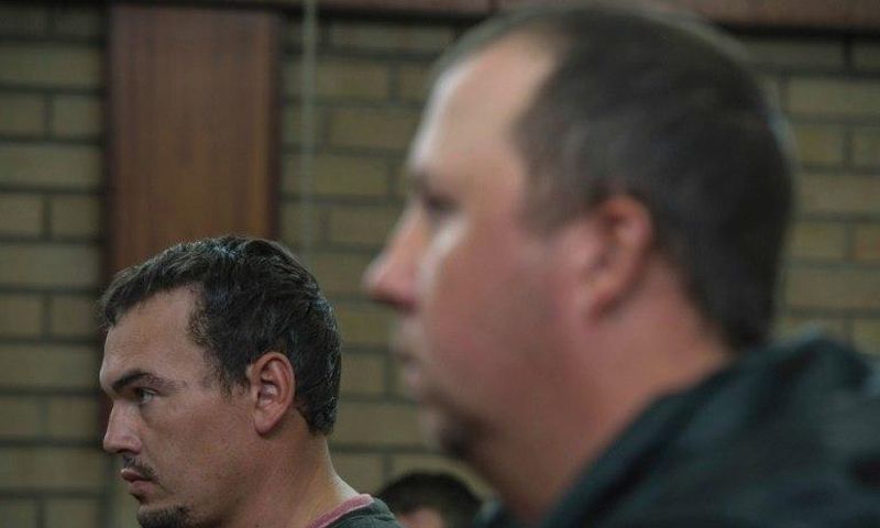 Willem Oosthuizen (right) and Theo Martins Jackson face charges of kidnapping and assaulting a colleague as they appeared at the Middleburg Magistrate Court on November 16, 2016