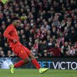 Liverpool's English striker Daniel Sturridge shoots to score their second goal during the English Football League Cup fourth round match between Liverpool and Tottenham Hotspur at Anfield in Liverpool north west England on October 25, 2016