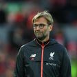 Liverpool's manager Jurgen Klopp stands on the pitch during the warm up ahead of the English Premier League football match between Liverpool and West Bromwich Albion at Anfield in Liverpool, north west England on October 22, 2016