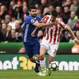 Chelsea's Diego Costa (L) fights for the ball with Stoke City's Geoff Cameron during their English Premier League match, at the Bet365 Stadium in Stoke-on-Trent, on March 18, 2017
