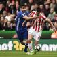 Chelsea's Diego Costa (L) fights for the ball with Stoke City's Geoff Cameron during their English Premier League match, at the Bet365 Stadium in Stoke-on-Trent, on March 18, 2017