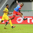 Democratic Republic of the Congo's forward Junior Kabananga kicks the ball to score past Togo's forward Serge Gakpe (L) during the 2017 Africa Cup of Nations group C football match between Togo and DR Congo in Port-Gentil on January 24, 2017