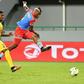 Democratic Republic of the Congo's forward Junior Kabananga kicks the ball to score past Togo's forward Serge Gakpe (L) during the 2017 Africa Cup of Nations group C football match between Togo and DR Congo in Port-Gentil on January 24, 2017