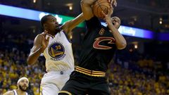 Kevin Durant (L) of the Golden State Warriors fights for the ball with Channing Frye of the Cleveland Cavaliers in game two of the 2017 NBA Finals, at ORACLE Arena in Oakland, California, on June 4