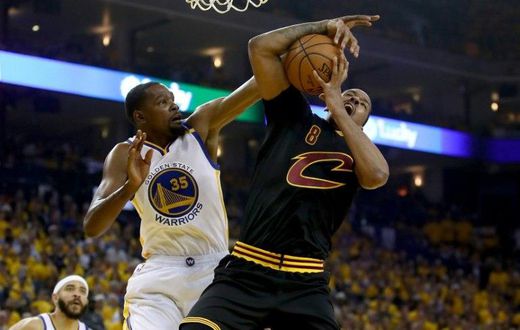 Kevin Durant (L) of the Golden State Warriors fights for the ball with Channing Frye of the Cleveland Cavaliers in game two of the 2017 NBA Finals, at ORACLE Arena in Oakland, California, on June 4