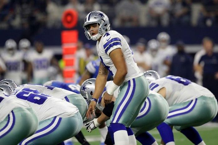 Dak Prescott of the Dallas Cowboys prepares to take the snap as the Cowboys play the Detroit Lions during the first half, at AT&T Stadium in Arlington, Texas, on December 26, 2016