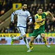 Wes Hoolahan (centre) scored the opener for Norwich as the Canaries beat Rotherham to go top of the Championship