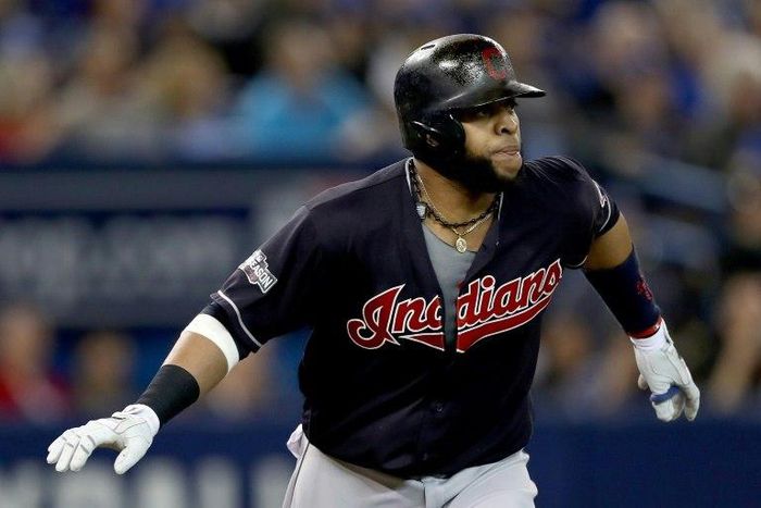 Carlos Santana of the Cleveland Indians hits a solo home run in the third inning against the Toronto Blue Jays during game five of the American League Championship Series