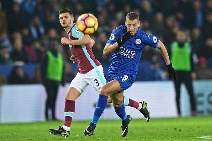 West Ham United's defender Aaron Cresswell (L) vies with Leicester City's striker Islam Slimani during an English Premier League football match at King Power Stadium in Leicester, central England on December 31, 2016
