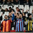 Besiktas, Fenerbahce, Galatasaray and Trabzon's supporters cheer prior to the Ziraat Turkish Cup football match between Besiktas and Kayserispor on December 14, 2016 at Vodafone arena stadium, in Istanbul