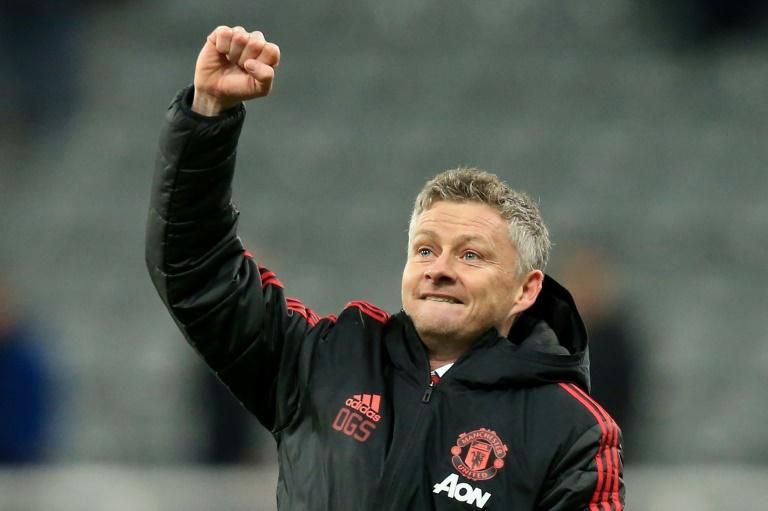 Never let me go: Ole Gunnar Solskjaer celebrates victory at Newcastle on Wednesday