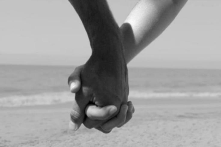 Couple holding hands
