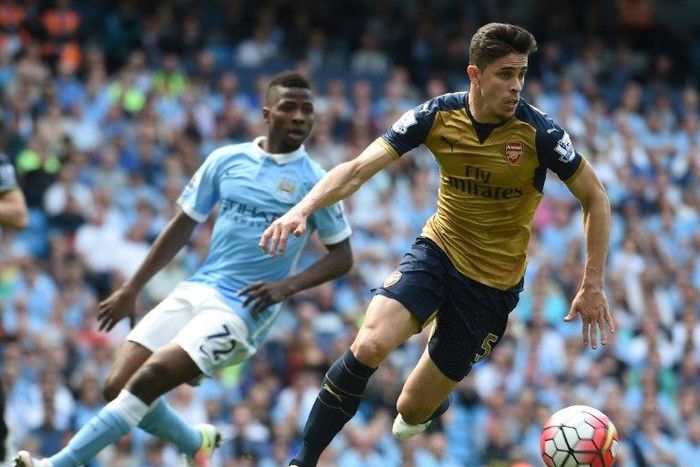Arsenal's Brazilian defender Gabriel (R) gives an emotional tribute to the victims of the Chapecoense plane crash after his friend Caio Junior was one of 71 people killed in the tragedy