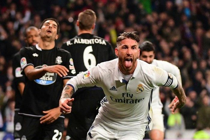 Real Madrid's captain Sergio Ramos celebrates after scoring a goal during their Spanish La Liga match against Deportivo la Coruna, at the Santiago Bernabeu stadium in Madrid, on December 10, 2016