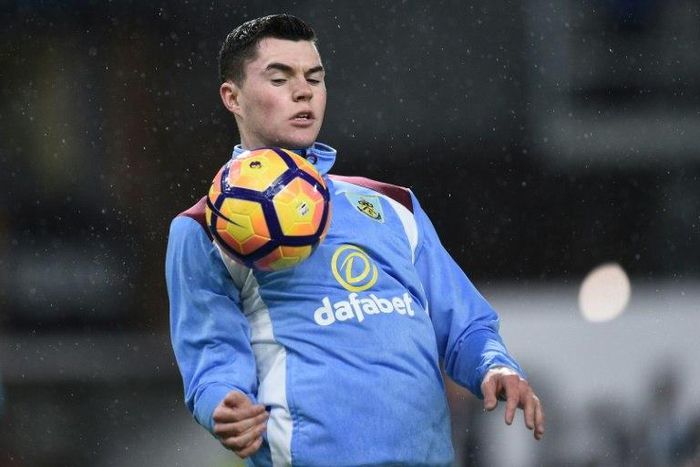 Burnley's defender Michael Keane warms up ahead of the English Premier League football match agaisnt Leicester City at Turf Moor in Burnley, England on January 31, 2017