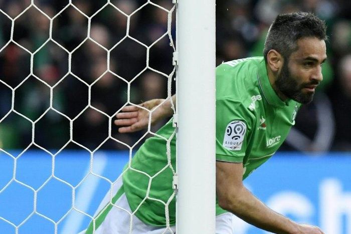 Loic Perrin celebrates after scoring for Saint-Etienne during a French league match against Lorient on February 12, 2017