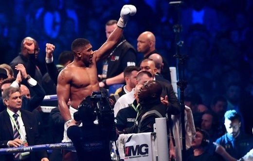 Britain's Anthony Joshua celebrates in the ring after his victory over Ukraine's Wladimir Klitschko in the eleventh round of their IBF, IBO and WBA, world Heavyweight title fight at Wembley Stadium in north west London on April 29, 2017