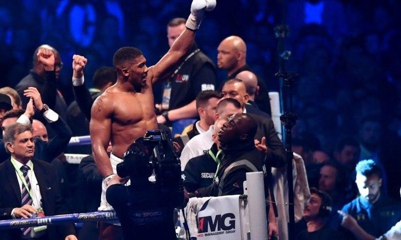 Britain's Anthony Joshua celebrates in the ring after his victory over Ukraine's Wladimir Klitschko in the eleventh round of their IBF, IBO and WBA, world Heavyweight title fight at Wembley Stadium in north west London on April 29, 2017