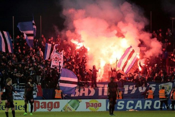 Bastia's supporters celebrate during the L1 football match between Bastia (SCB) and Nice (OGC) on January 20, 2017 at the Armand Cesari stadium in Bastia, on the French Mediterranean island of Corsica