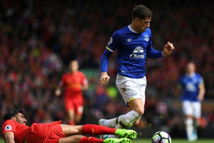 Everton's midfielder Ross Barkley (R) vies with Liverpool's midfielder Emre Can during the English Premier League football match between Liverpool and Everton at Anfield in Liverpool, north west England on April 1, 2017