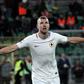 Roma's forward from Bosnia-Herzegovina Edin Dzeko celebrates after scoring during the Italian Serie A football match Palermo vs AS Roma, on March 12, 2017