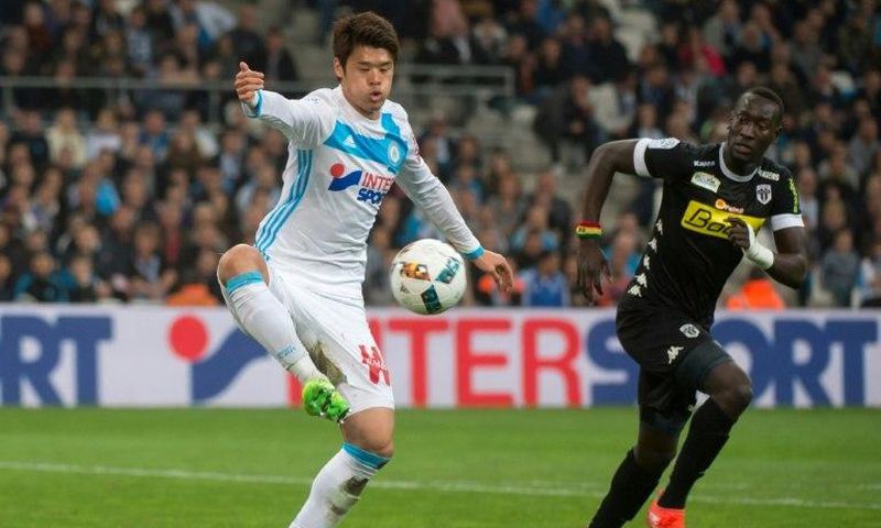 Olympique de Marseille's Japanese defender Hiroki Sakai (L) has won over hearts and minds in France where he is seen as an ambassador of his homeland