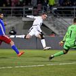 Italy's forward Andrea Belotti (C) scores past Liechtenstein's defender Michele Polverino (L) and goalkeeper Peter Jehle on November 12, 2016