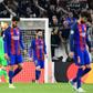 Barcelona's Lionel Messi (C) and teammates look dejected at the end of their UEFA Champions League match against Juventus, at the Juventus stadium in Turin, on April 11, 2017