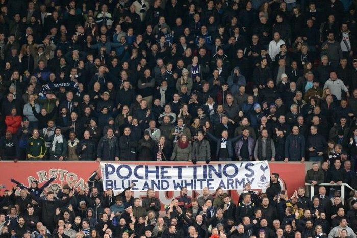 Tottenham Hotspur fans celebrate after winning 4-0 during the English Premier League football match against Stoke City April 18, 2016