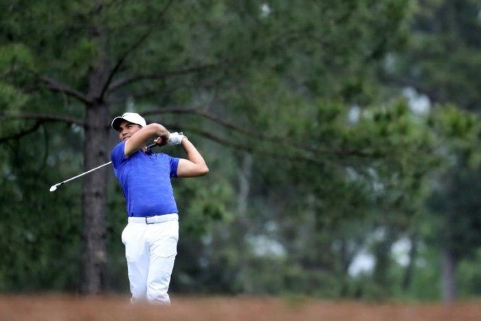 Jason Day of Australia plays a shot on the 15th hole at Augusta National Golf Club