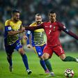 Portugal's forward Cristiano Ronaldo (R) vies with Andorra's midfielder Victor Rodriguez (L) during the World Cup 2018 qualification match