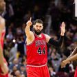 Nikola Mirotic (C) of the Chicago Bulls celebrates with teammates after scoring during a NBA game against the Cleveland Cavaliers, in Cleveland, Ohio, in February 2017