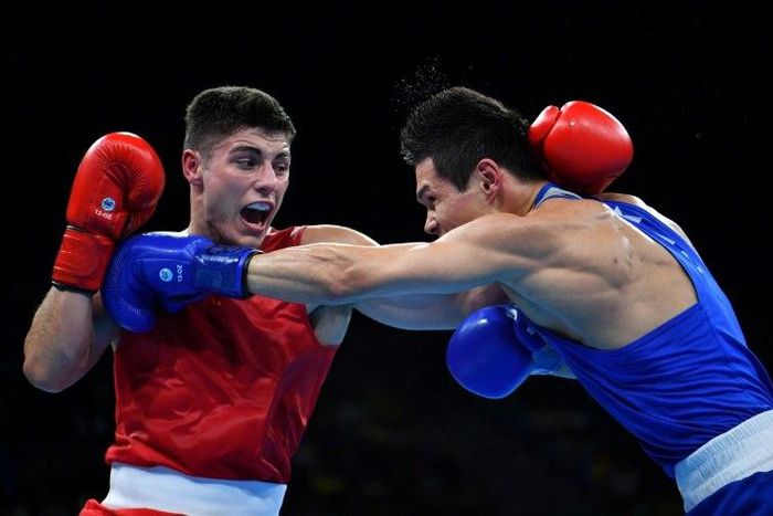 Great Britain's Josh Kelly (L) fights Kazakhstan's Daniyar Yeleussinov during the Men's Welter (69kg) match at the Rio 2016 Olympic Games August 11, 2016
