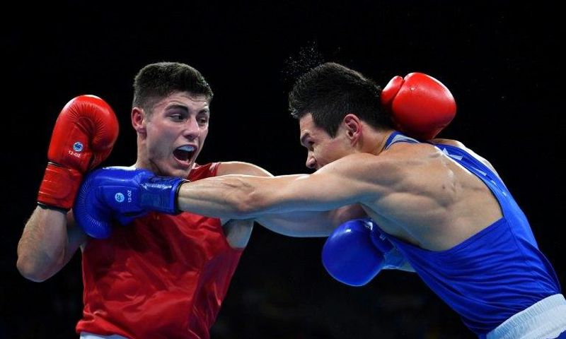 Great Britain's Josh Kelly (L) fights Kazakhstan's Daniyar Yeleussinov during the Men's Welter (69kg) match at the Rio 2016 Olympic Games August 11, 2016