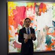 A Christie's official speaks in front of "Untitled XXV" by Willem de Kooning in New York during a press preview