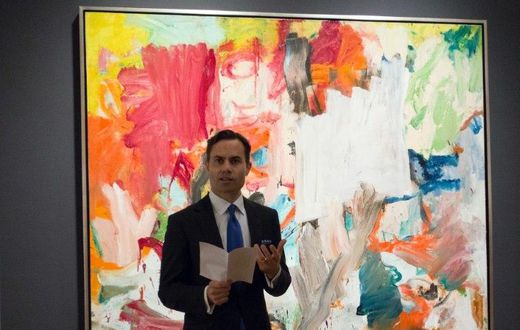 A Christie's official speaks in front of "Untitled XXV" by Willem de Kooning in New York during a press preview