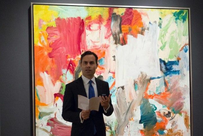 A Christie's official speaks in front of "Untitled XXV" by Willem de Kooning in New York during a press preview